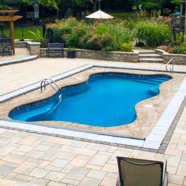 Inground pool with spa: Copano Pools and Spas