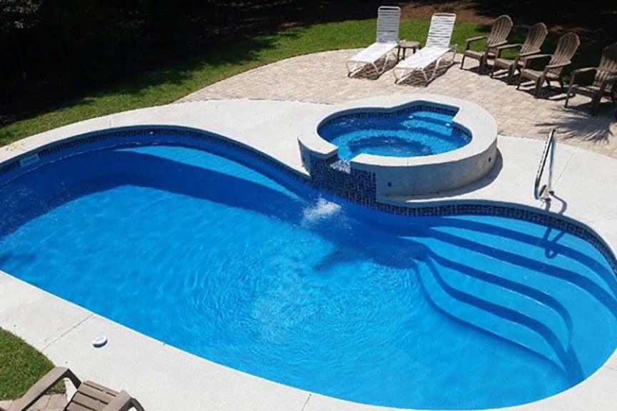 Copano Pools and Spas stunning finished pool in a residential landscape